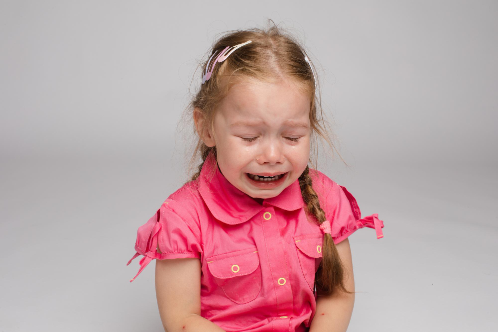 Upset toddler crying, learning emotional regulation